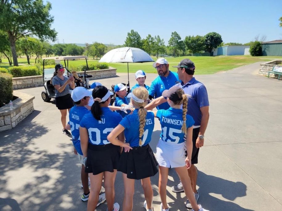 A group of golf students being instructed by their golf coach, Coach Thomas Valdez of Hawkeye Golf Academy.